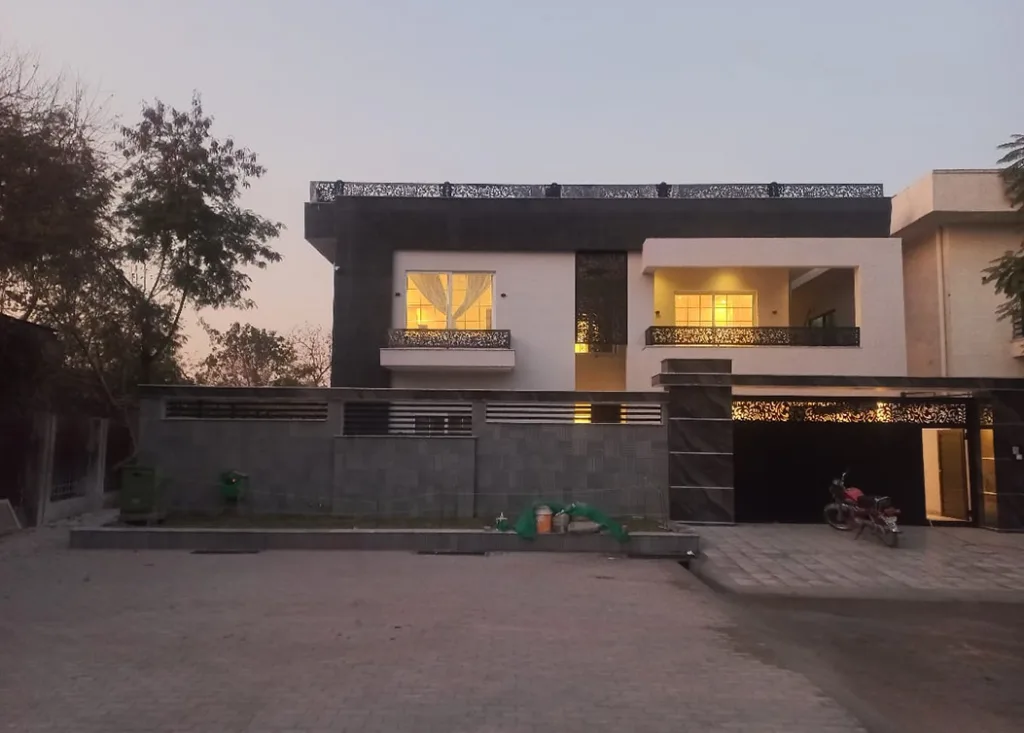 contemporary home with illuminated interiors and balcony by hescon engineering