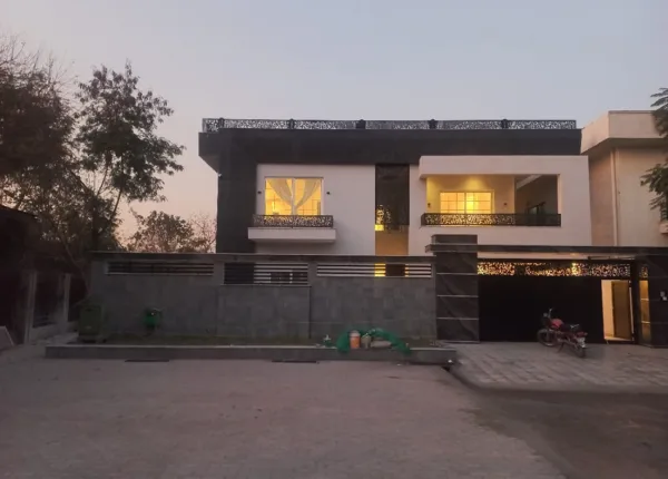contemporary home with illuminated interiors and balcony by hescon engineering