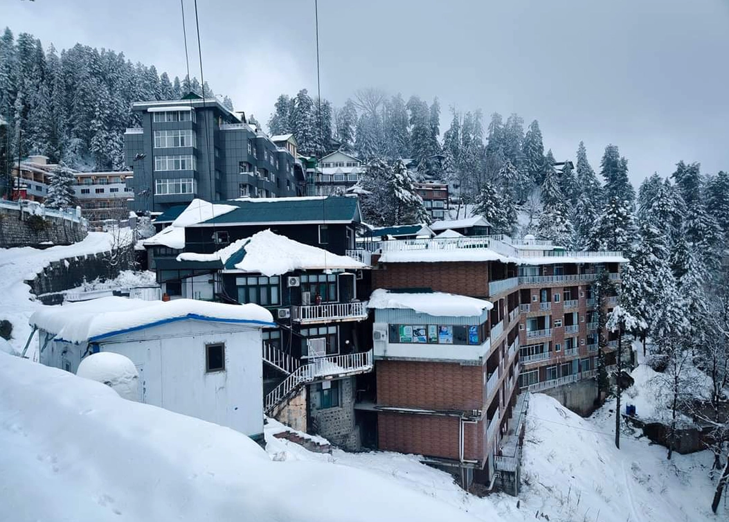 panoramic view of elite hotel and surrounding hills in snowfall by hescon engineering