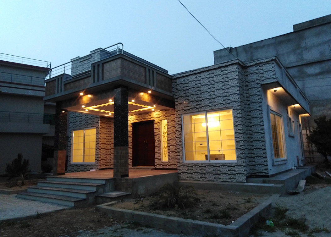 stylish home exterior with illuminated entrance by hescon engineering