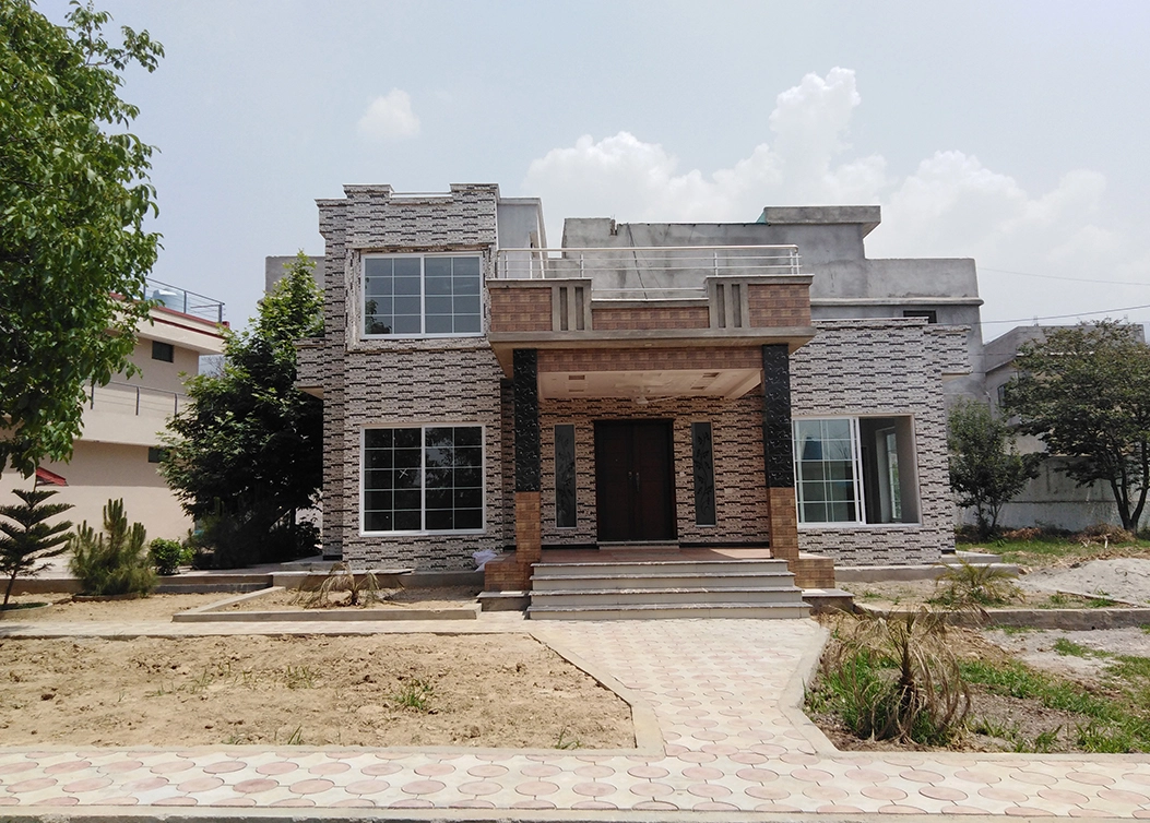 under construction house with front porch design by hescon engineering
