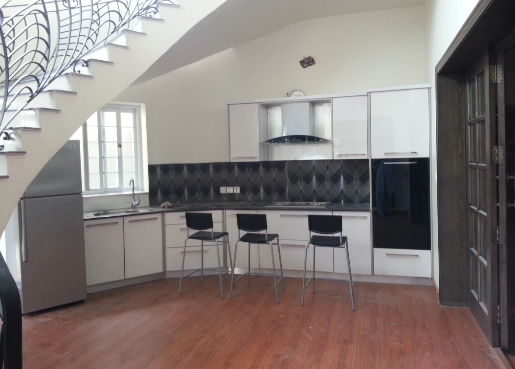contemporary white kitchen with black backsplash and open plan by hescone engineering