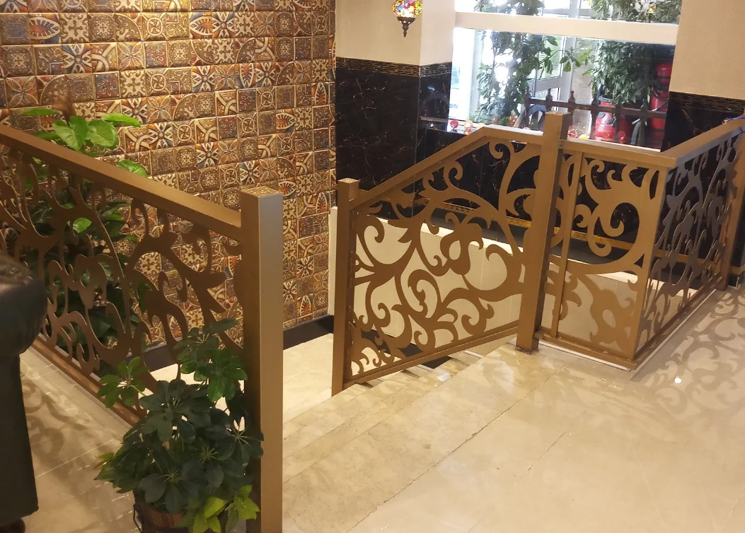 decorative laser-cut metal staircase railing by hescone engineering