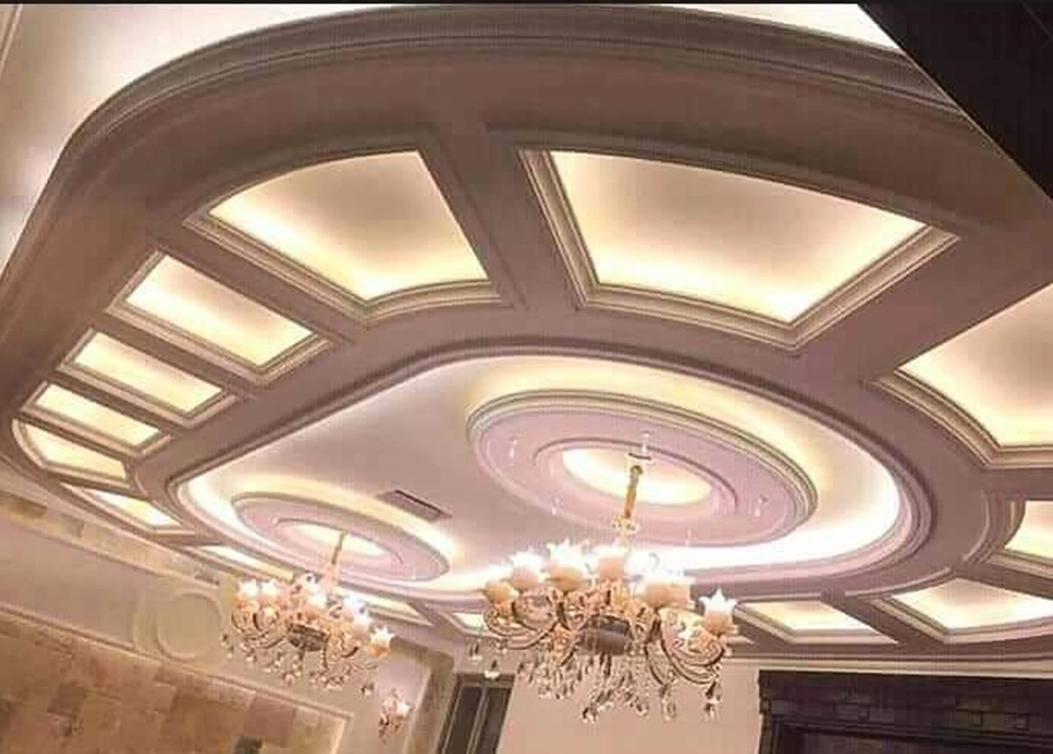 elegant false ceiling with chandeliers by hescone engineering