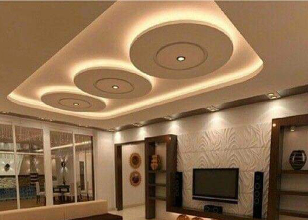 gypsum false ceiling with circular designs and spotlights by hescone engineering