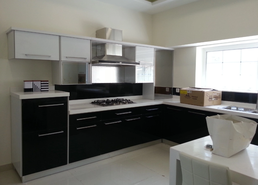 sleek black and white modular kitchen by hescone engineering