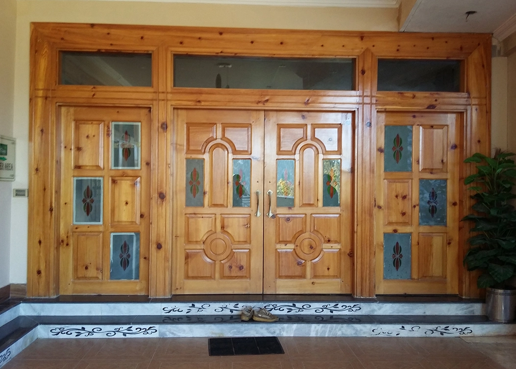 traditional wooden main entrance doors with glass panels by hescone engineering