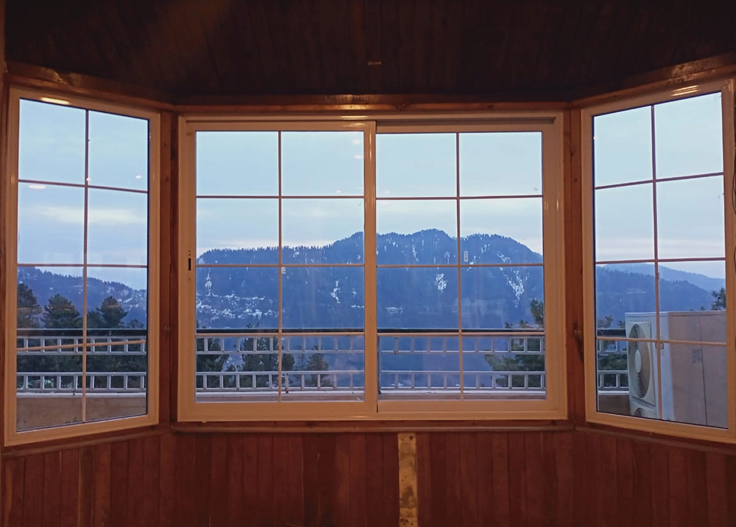 upvc bay window with mountain view by hescone engineering